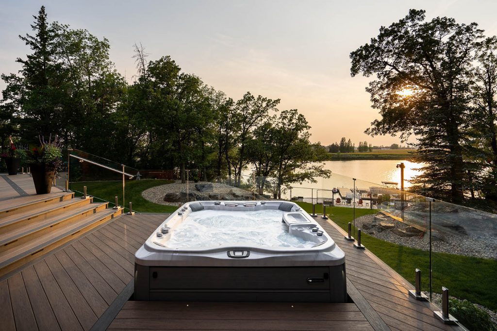 hot tub on deck at dusk overlooking river